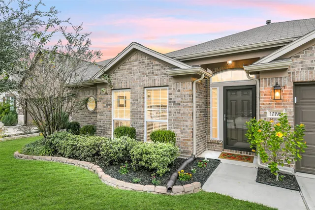 a front view of a house with garden