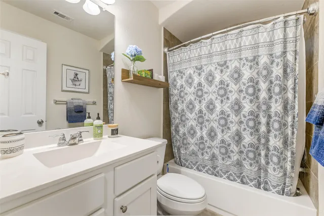 a view of a house with a yard and furniture