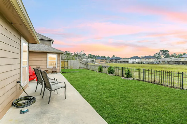 a view of a fire pit and outdoor kitchen