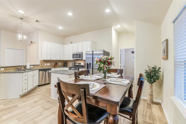 a view of a livingroom with furniture and a window