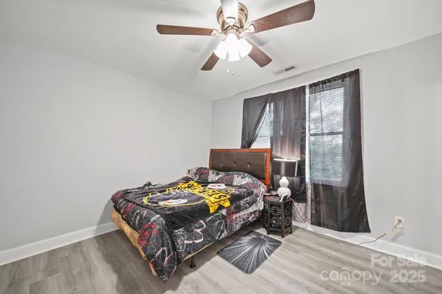 a bedroom with bed and a window