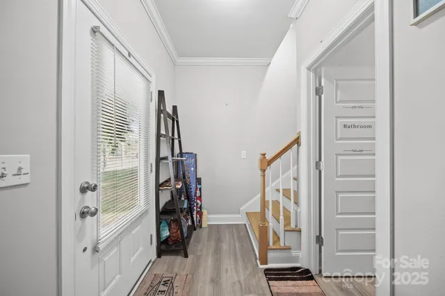 a living room with a flat screen tv and a fireplace