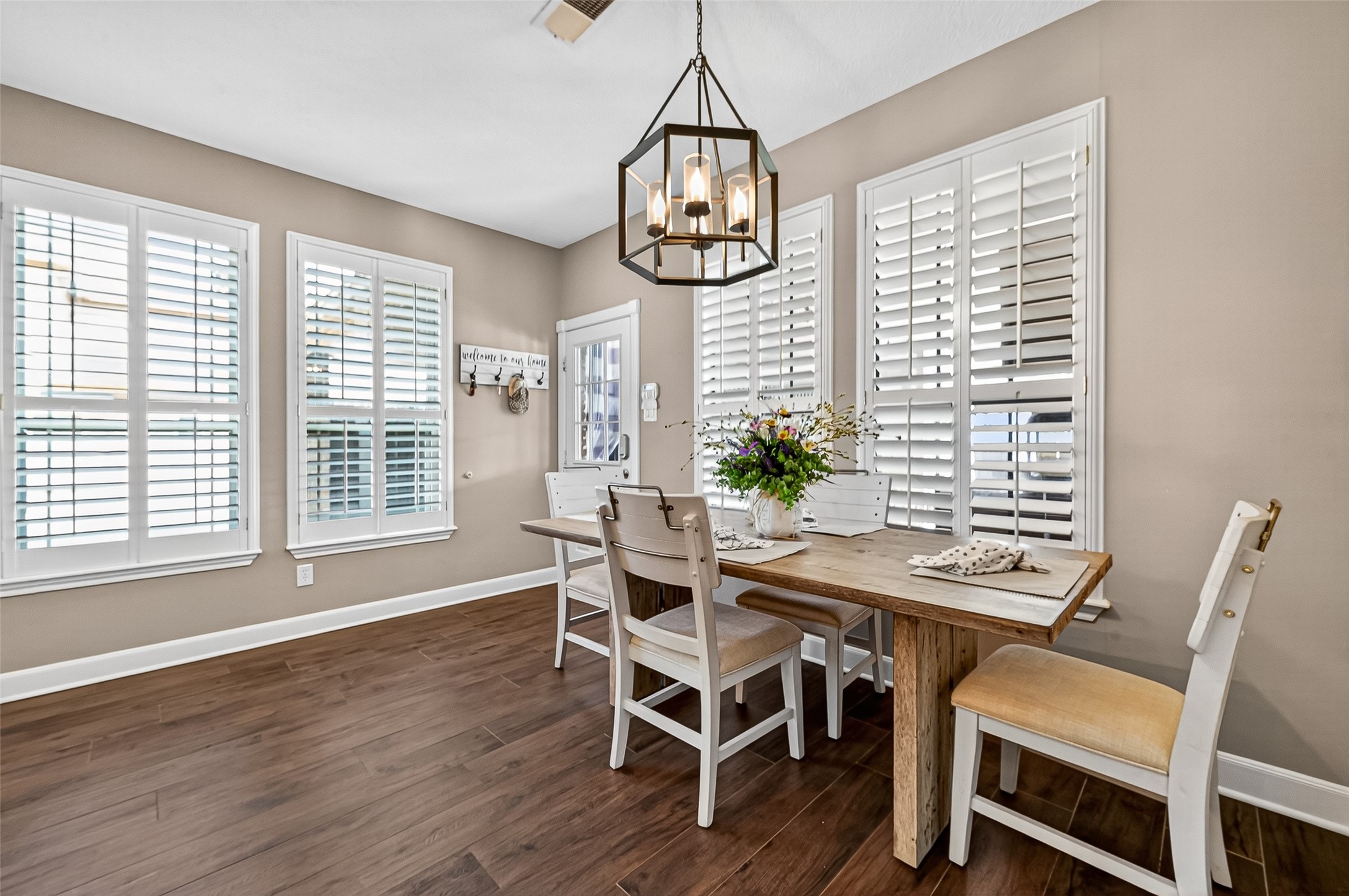5911 Springton Lane Spring, TX 77379 - Photo 12 of 43 a view of a dining room with furniture window and wooden floor