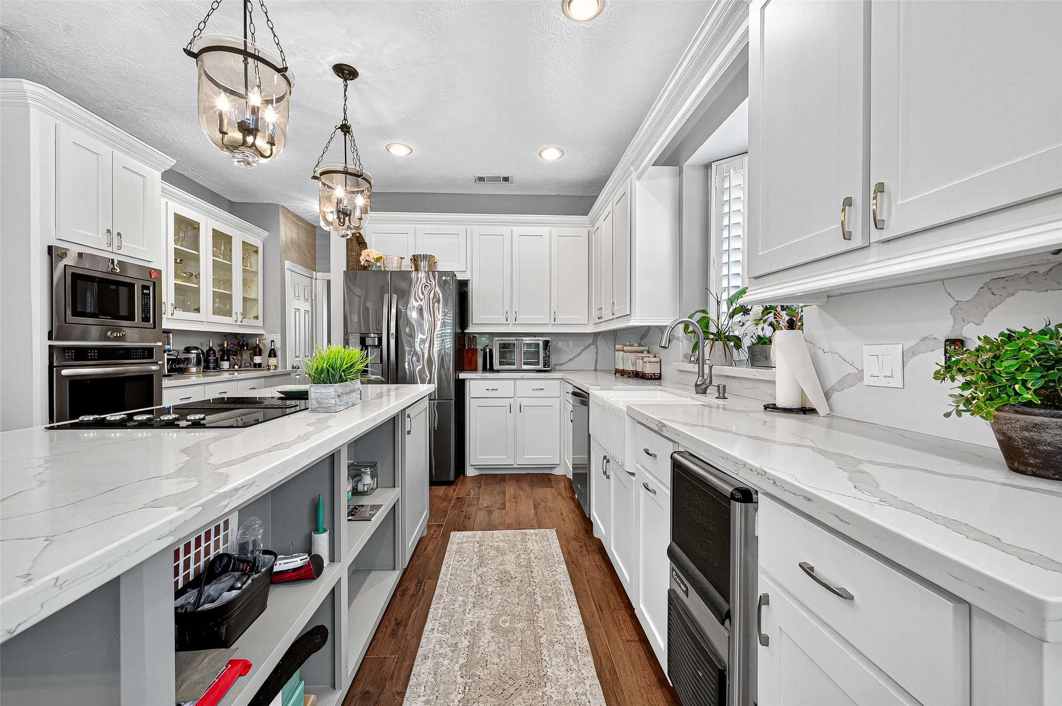 5911 Springton Lane Spring, TX 77379 - Photo 14 of 43 a kitchen with stainless steel appliances granite countertop a sink a stove and a refrigerator