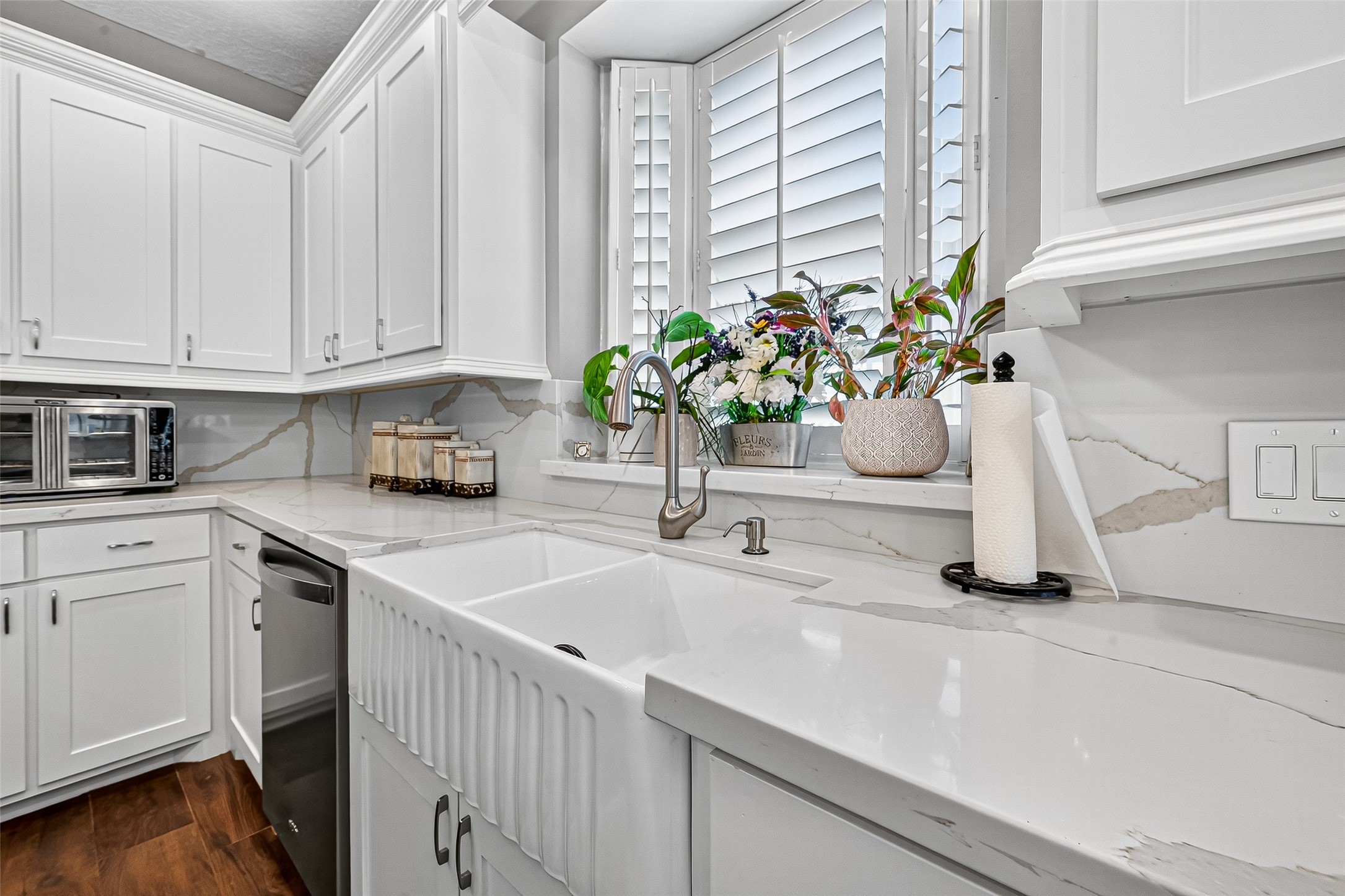 5911 Springton Lane Spring, TX 77379 - Photo 17 of 43 a kitchen with granite countertop a white sink and white cabinets