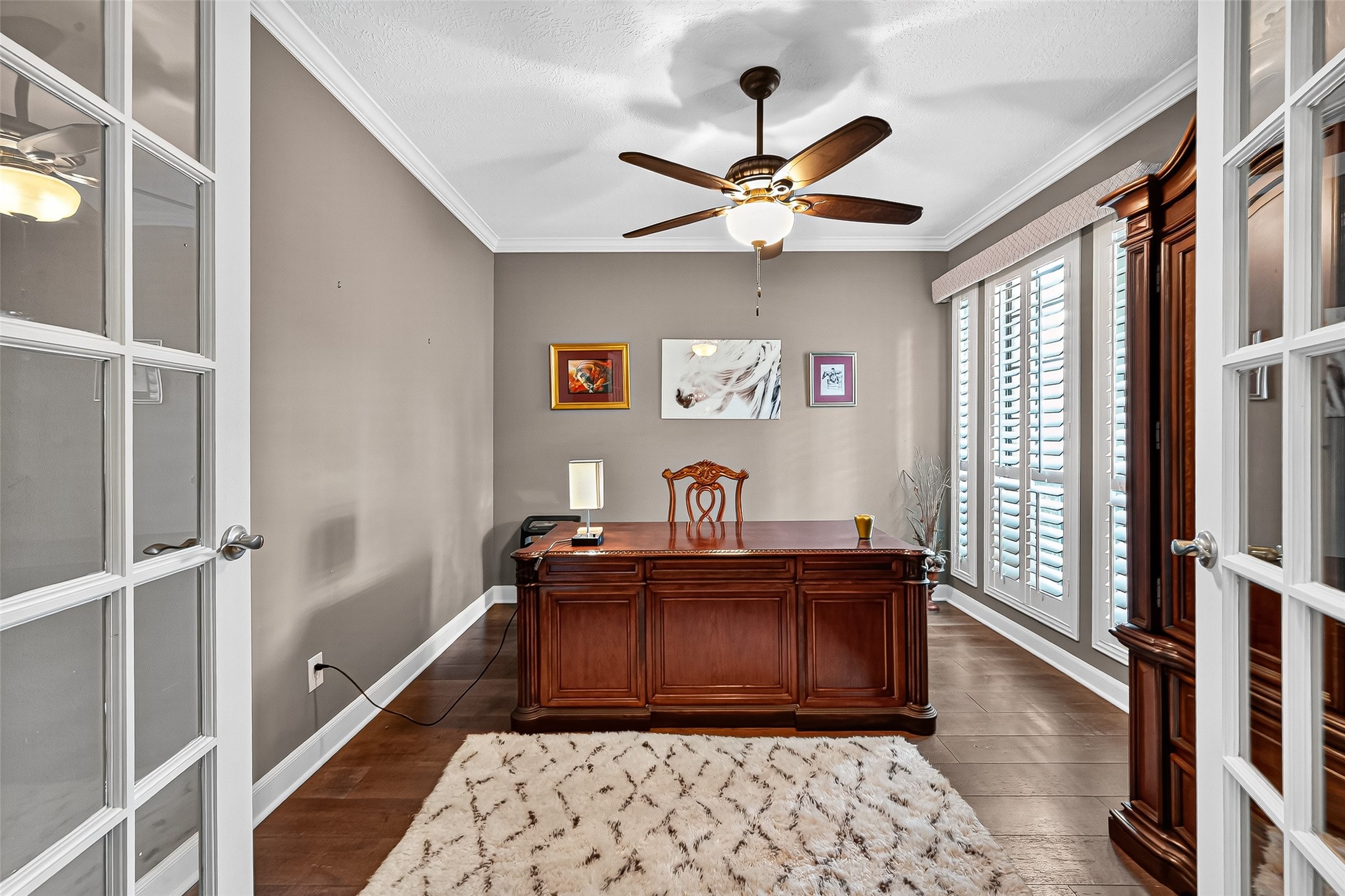 5911 Springton Lane Spring, TX 77379 - Photo 20 of 43 a bedroom with a bed and a chandelier