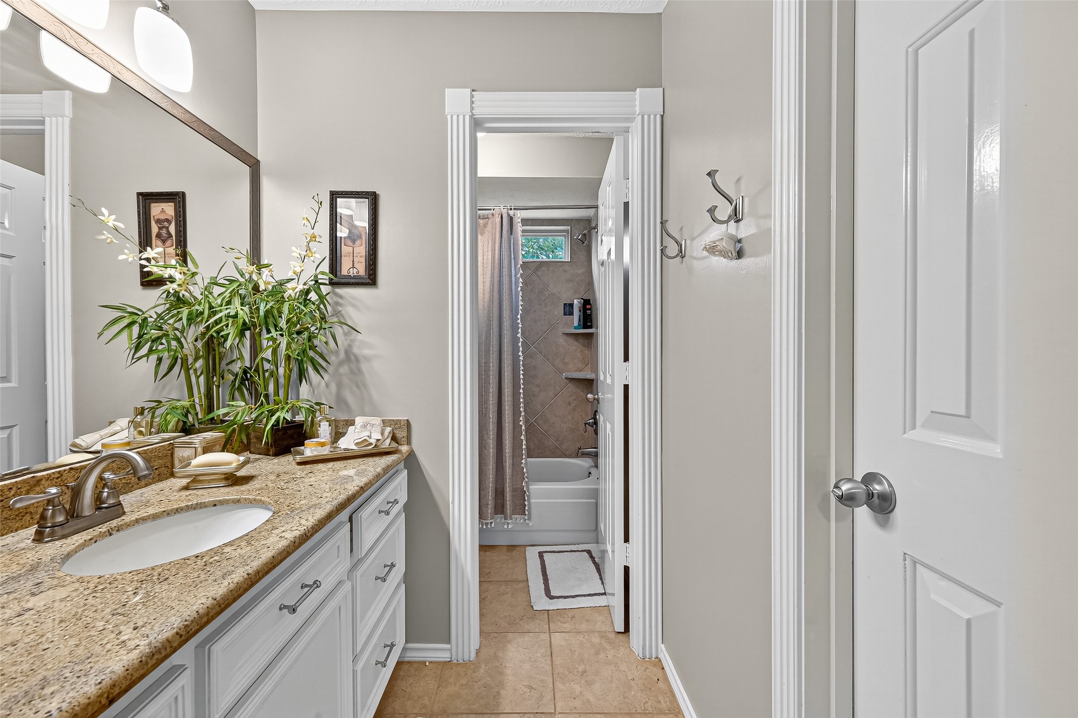 5911 Springton Lane Spring, TX 77379 - Photo 28 of 43 a bathroom with a granite countertop sink a mirror and a shower