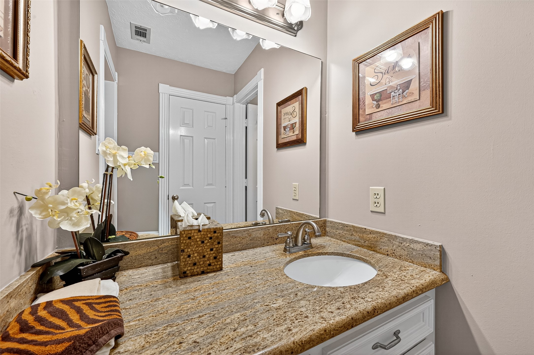 5911 Springton Lane Spring, TX 77379 - Photo 31 of 43 a bathroom with a granite countertop sink and a mirror