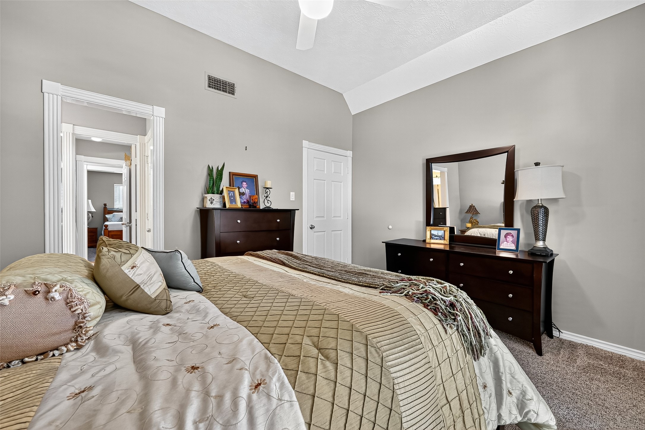 5911 Springton Lane Spring, TX 77379 - Photo 33 of 43 a bedroom with a bed and a mirror on dresser