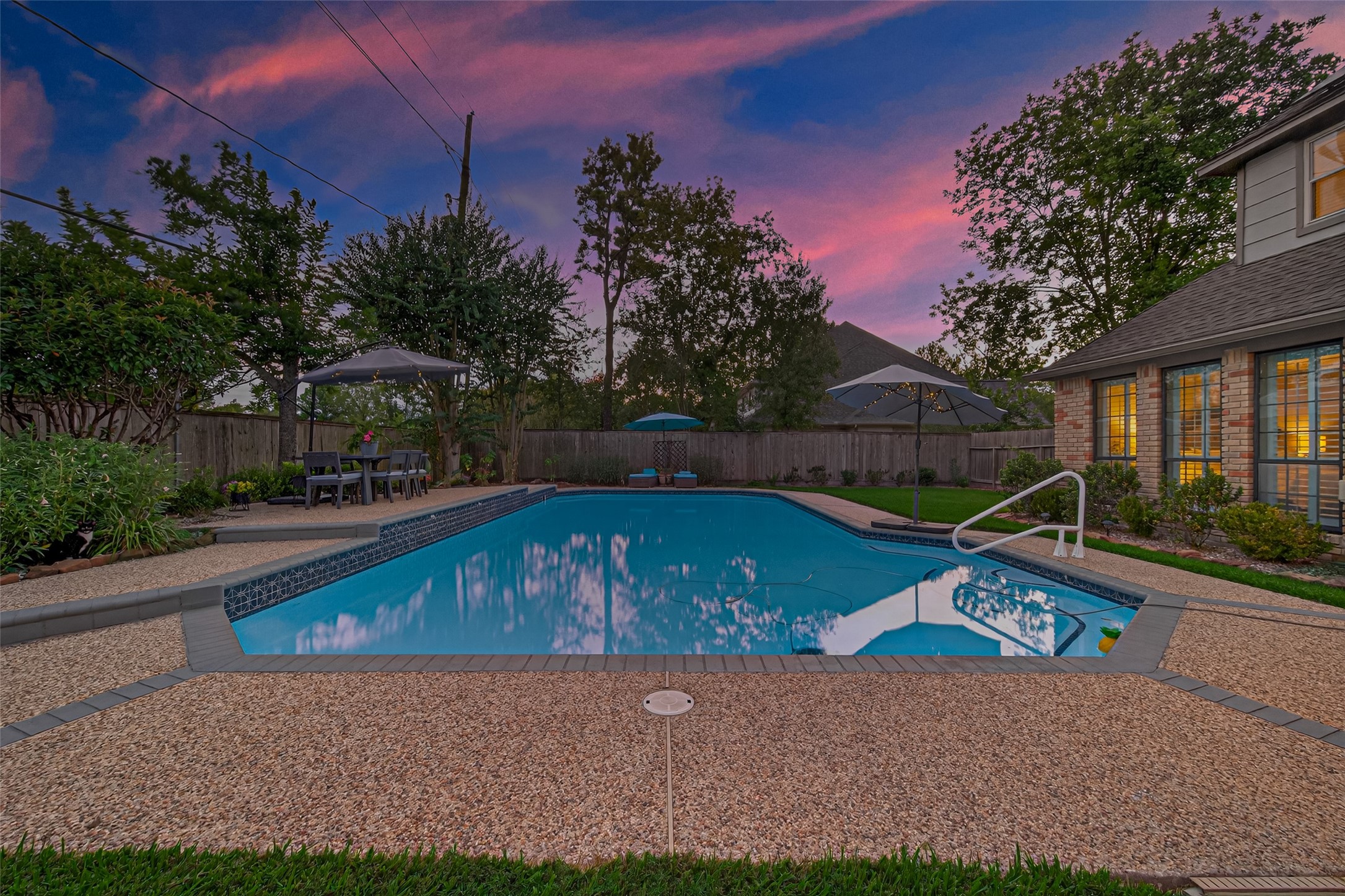 5911 Springton Lane Spring, TX 77379 - Photo 38 of 43 a view of backyard with swimming pool and outdoor seating
