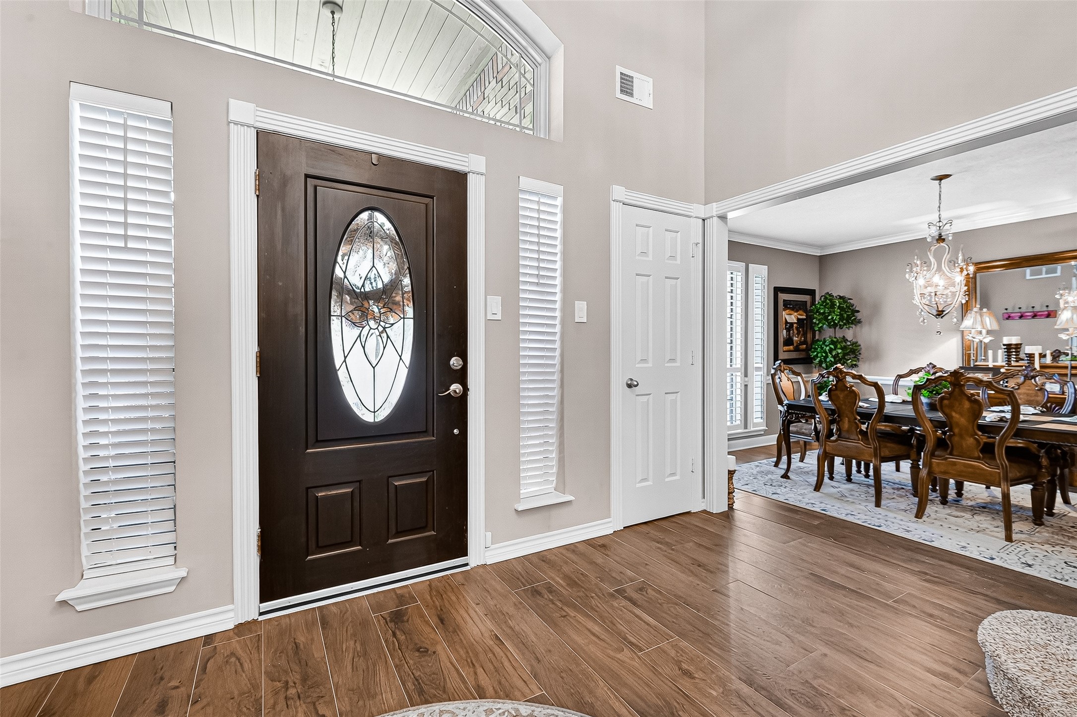 5911 Springton Lane Spring, TX 77379 - Photo 7 of 43 a view of a hallway with wooden floor windows and entryway