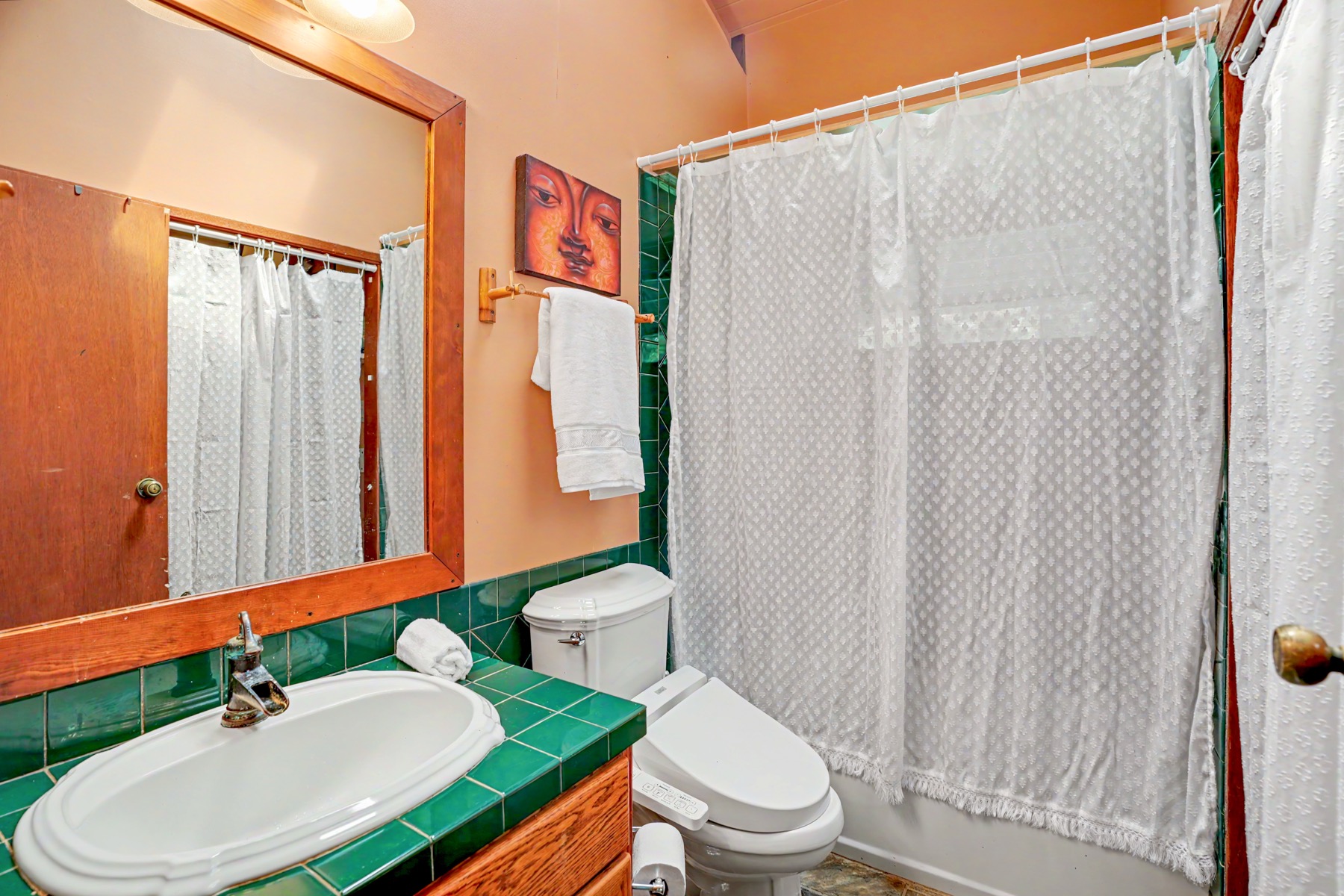 4470 A Wailapa Road Kilauea, HI 96754 - Photo 14 of 30 a bathroom with a sink toilet and shower