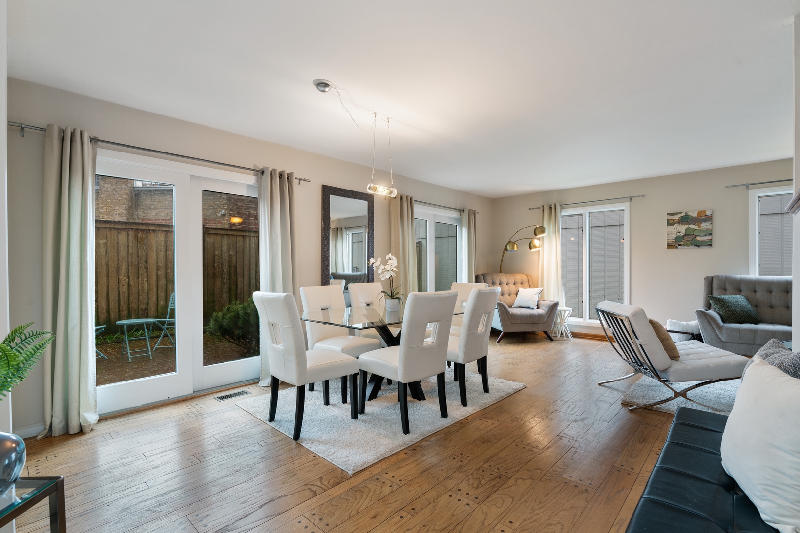 2626 Prairie Avenue, Unit B Evanston, IL 60201 - Photo 2 of 20 a living room with furniture wooden floor and a large window