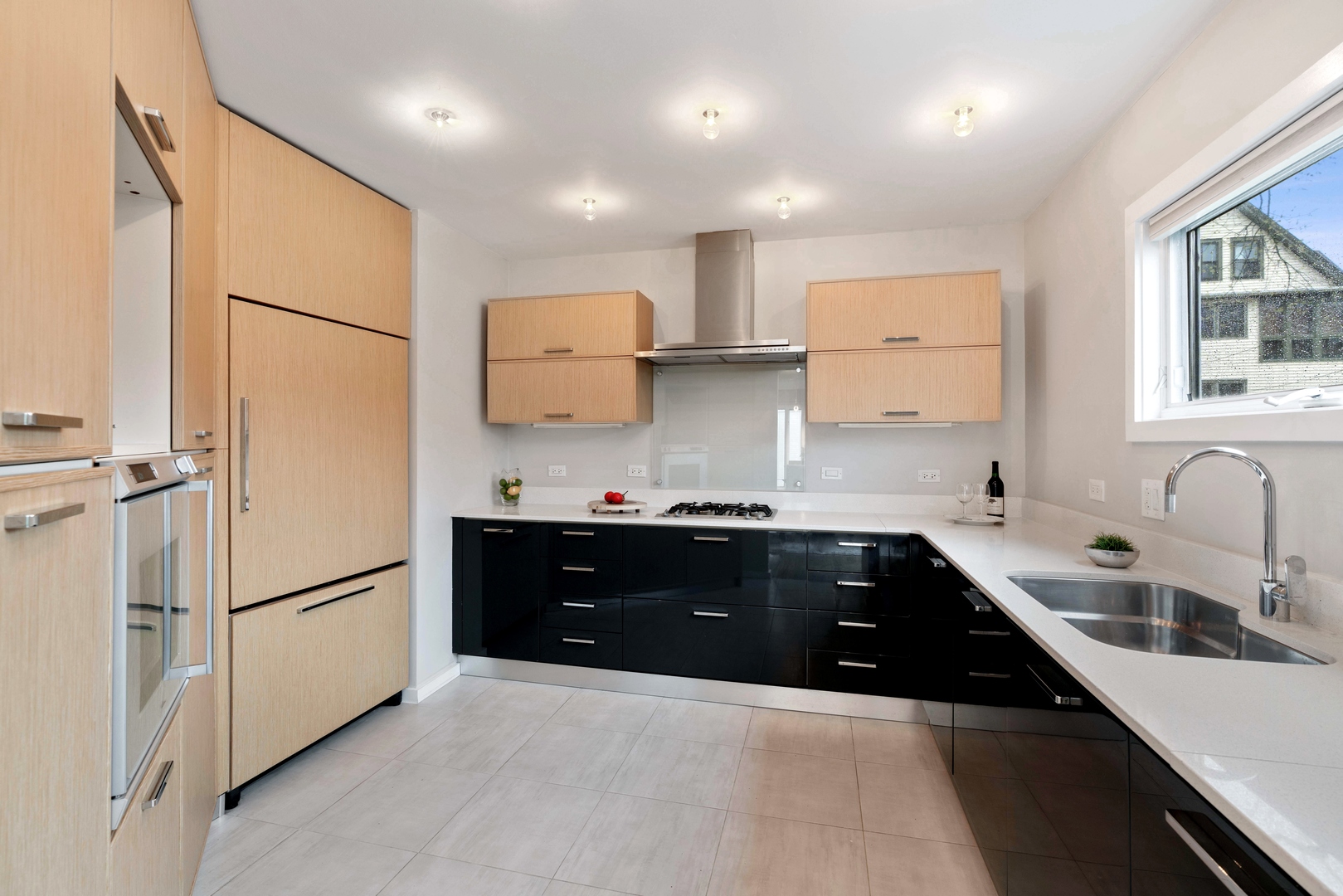 2626 Prairie Avenue, Unit B Evanston, IL 60201 - Photo 6 of 20 a kitchen with granite countertop a refrigerator and a sink