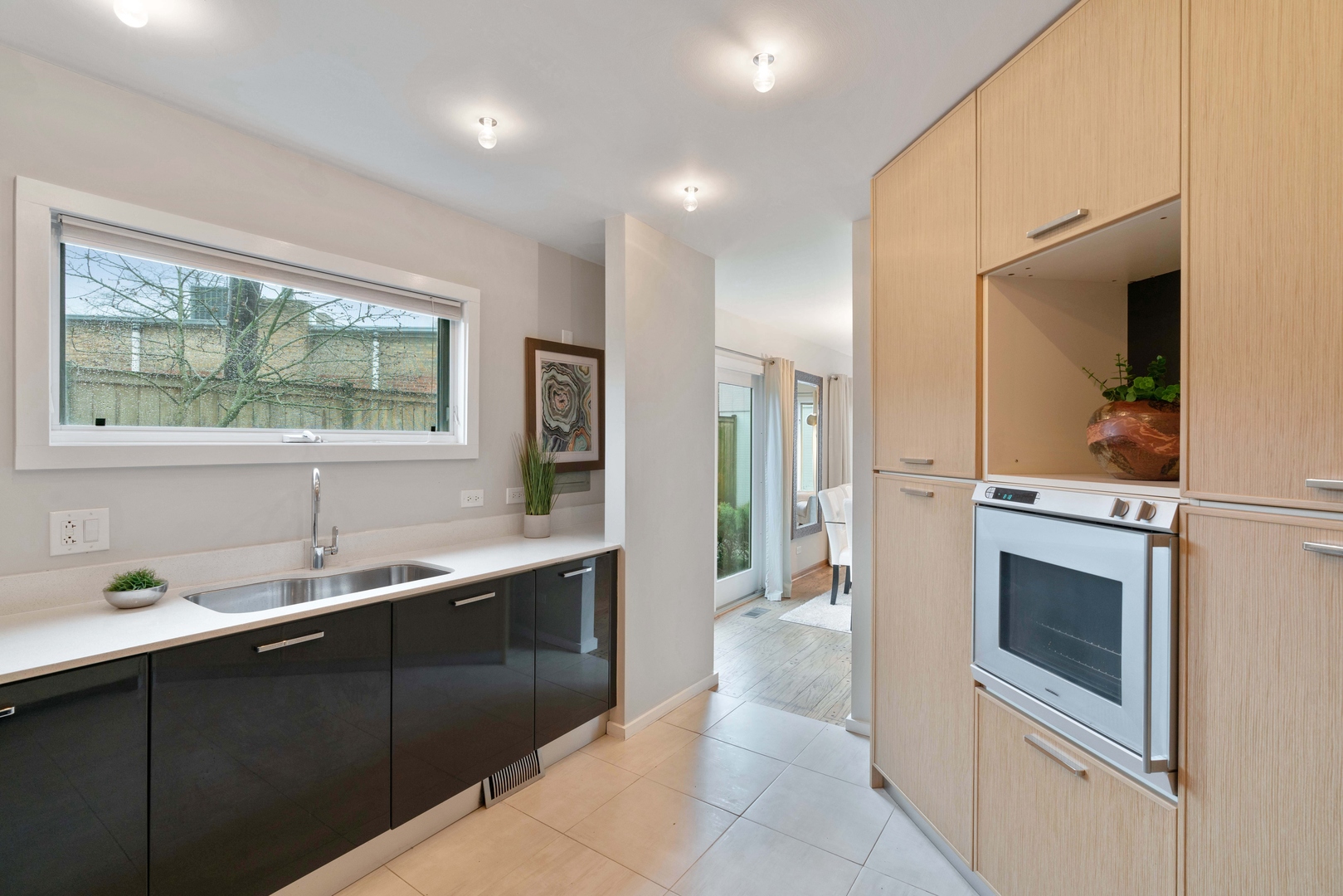 2626 Prairie Avenue, Unit B Evanston, IL 60201 - Photo 7 of 20 a kitchen with a sink and stainless steel appliances