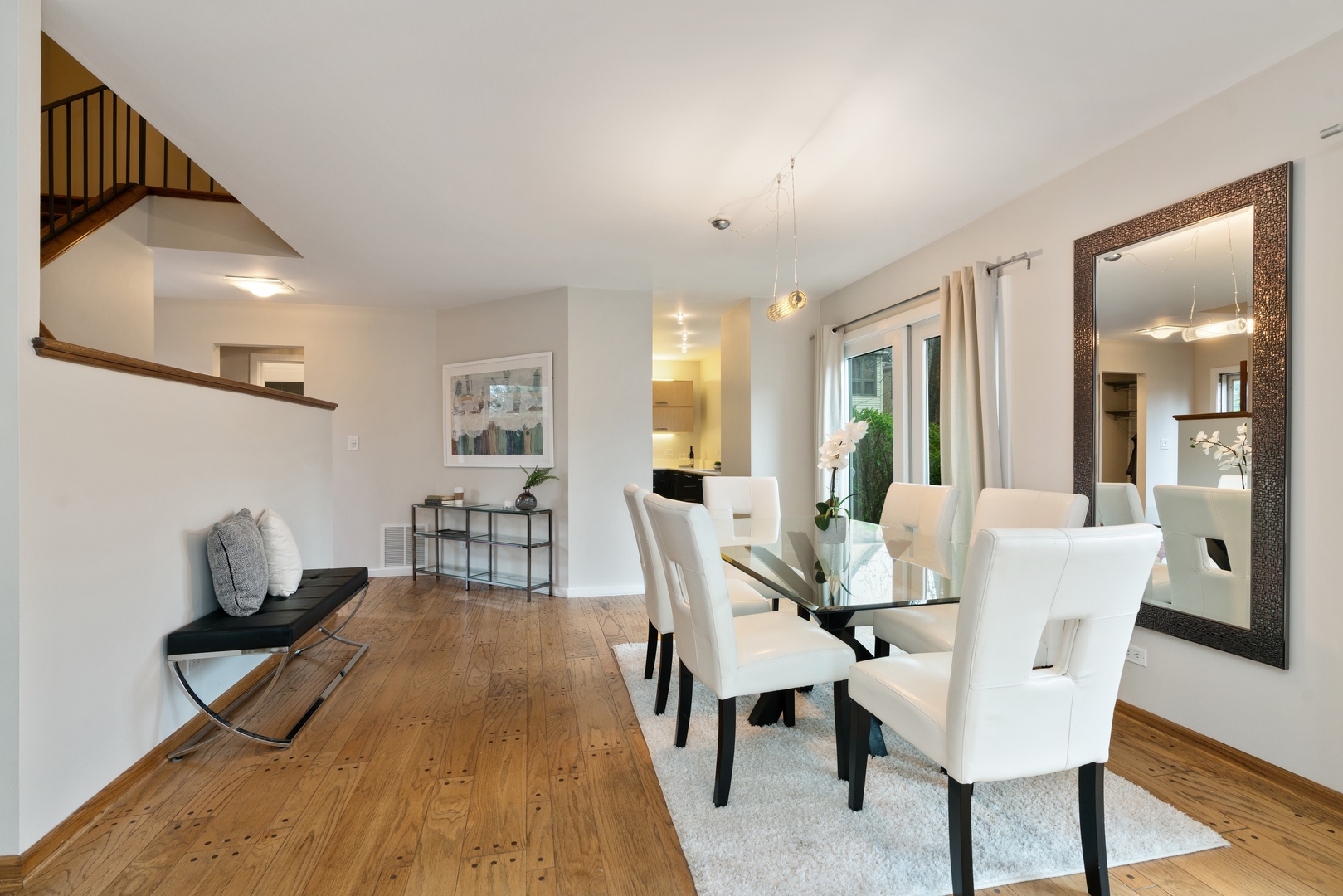 2626 Prairie Avenue, Unit B Evanston, IL 60201 - Photo 8 of 20 a dining room with furniture and wooden floor