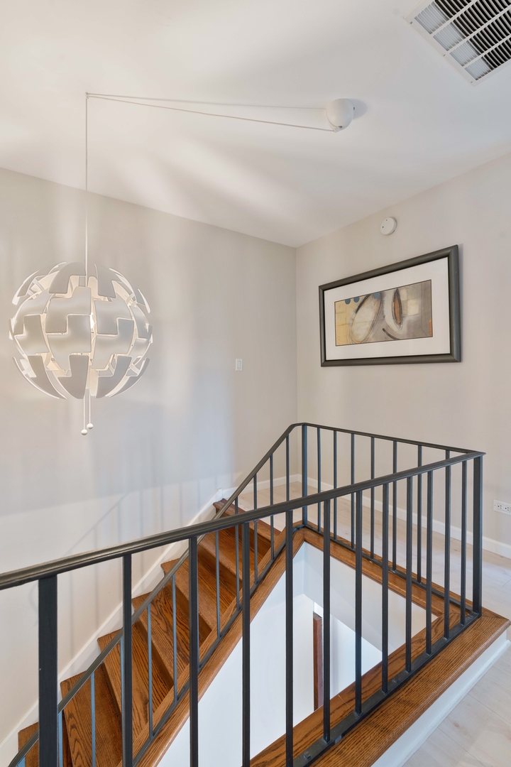 2626 Prairie Avenue, Unit B Evanston, IL 60201 - Photo 10 of 20 a view of staircase with wooden floor