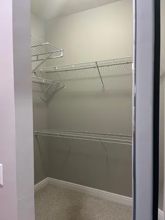 a view of a room with racks on the wall