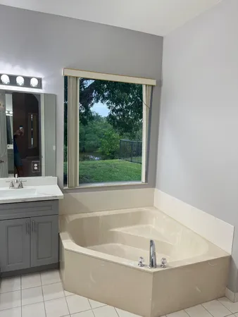 a bathroom with a bathtub and sink
