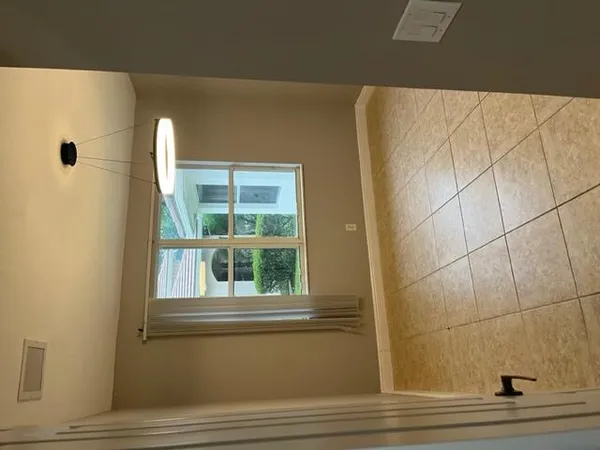 a view of a room with a large windows