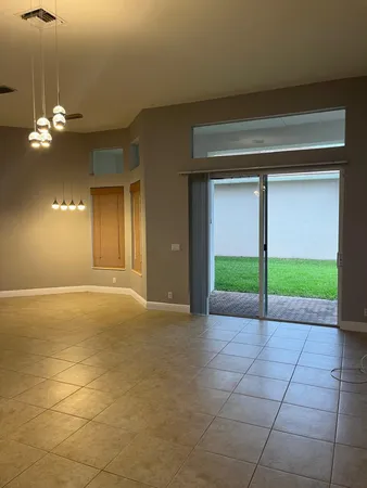 a view of an empty room with a fan