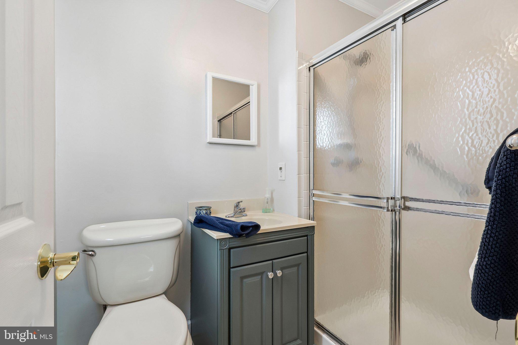 1 Balamor Lane Ewing, NJ 08628 - Photo 25 of 34 a white toilet sitting next to a bathroom sink