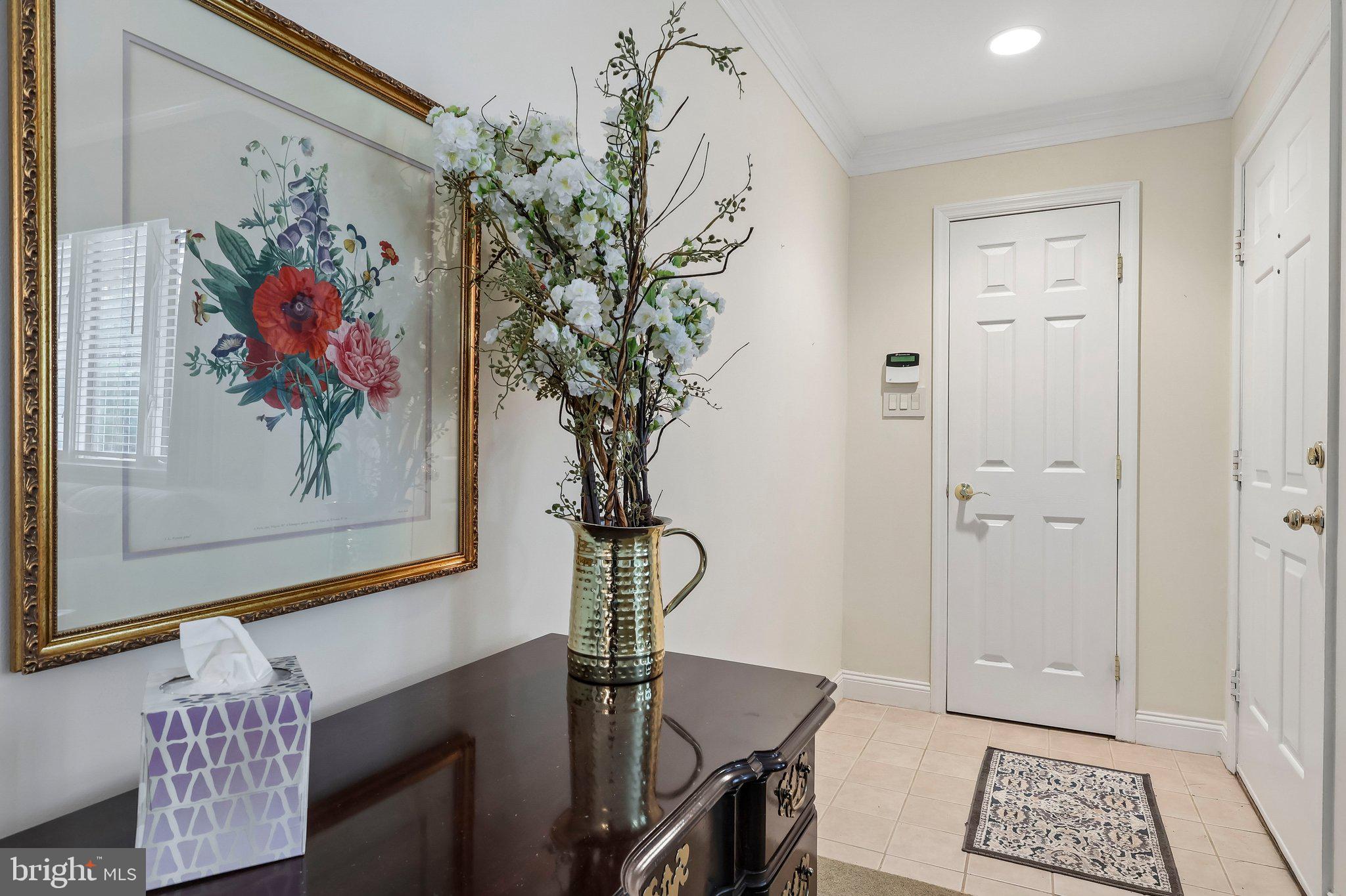 1 Balamor Lane Ewing, NJ 08628 - Photo 6 of 34 a view of a hallway with paintings on the wall