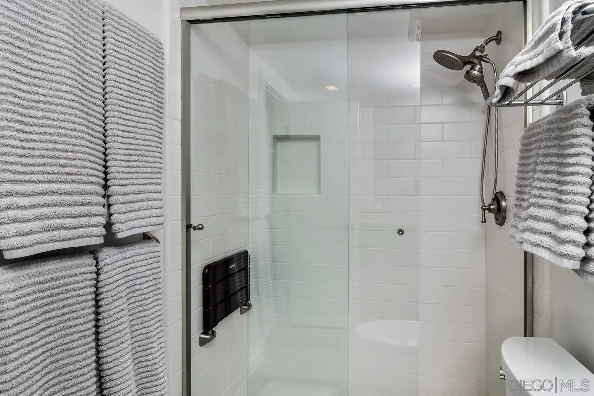 100 Coast Boulevard, Unit 304 La Jolla, CA 92037 - Photo 18 of 36 a bathroom with a shower and a toilet