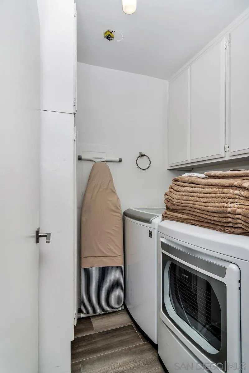 100 Coast Boulevard, Unit 304 La Jolla, CA 92037 - Photo 19 of 36 a utility room with dryer and washer