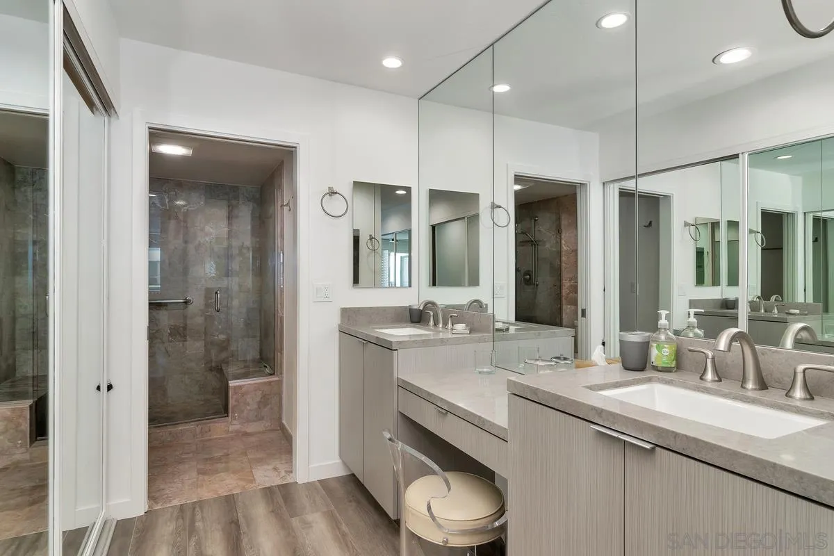 100 Coast Boulevard, Unit 304 La Jolla, CA 92037 - Photo 23 of 36 a bathroom with a sink a toilet and shower