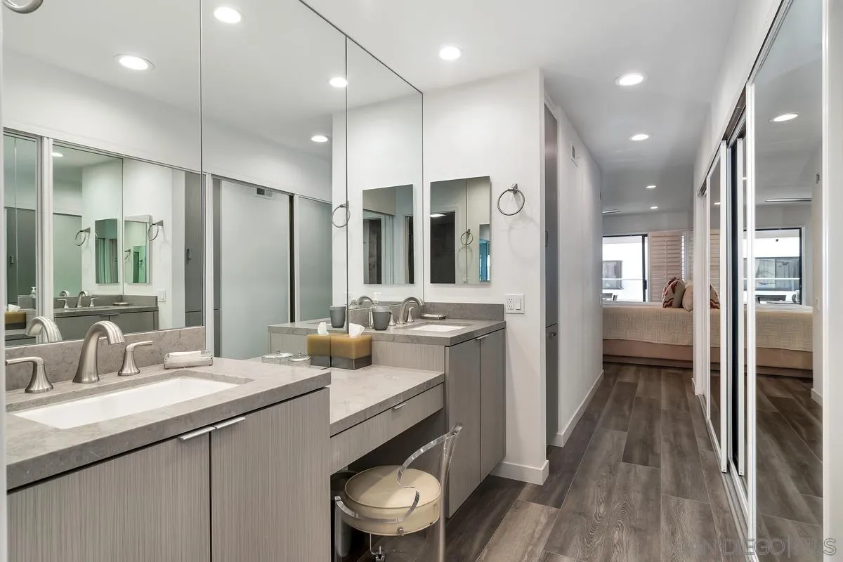 100 Coast Boulevard, Unit 304 La Jolla, CA 92037 - Photo 24 of 36 a bathroom with a sink a toilet and shower