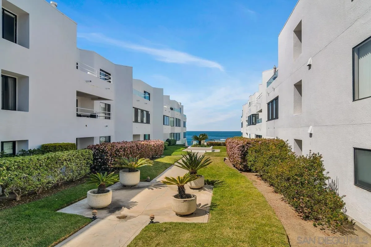 100 Coast Boulevard, Unit 304 La Jolla, CA 92037 - Photo 29 of 36 a view of a white house with a chairs in patio