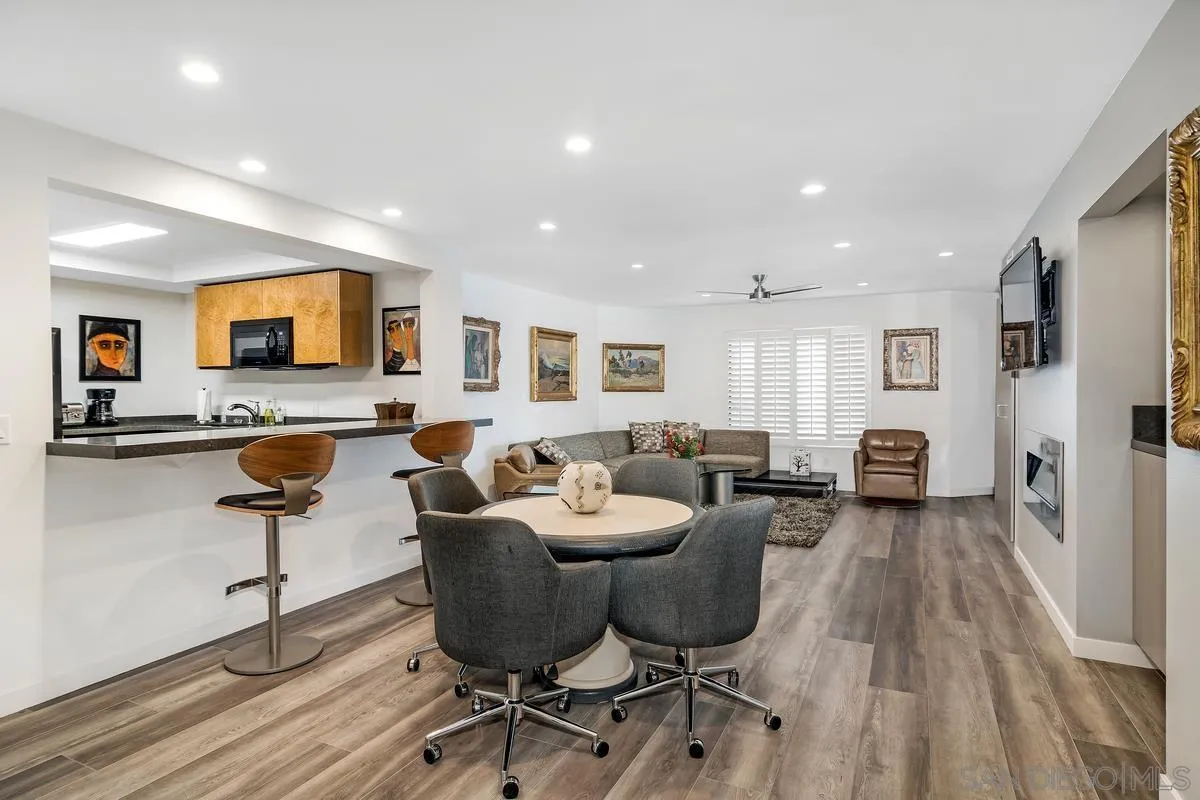 100 Coast Boulevard, Unit 304 La Jolla, CA 92037 - Photo 5 of 36 a living room with furniture and a flat screen tv