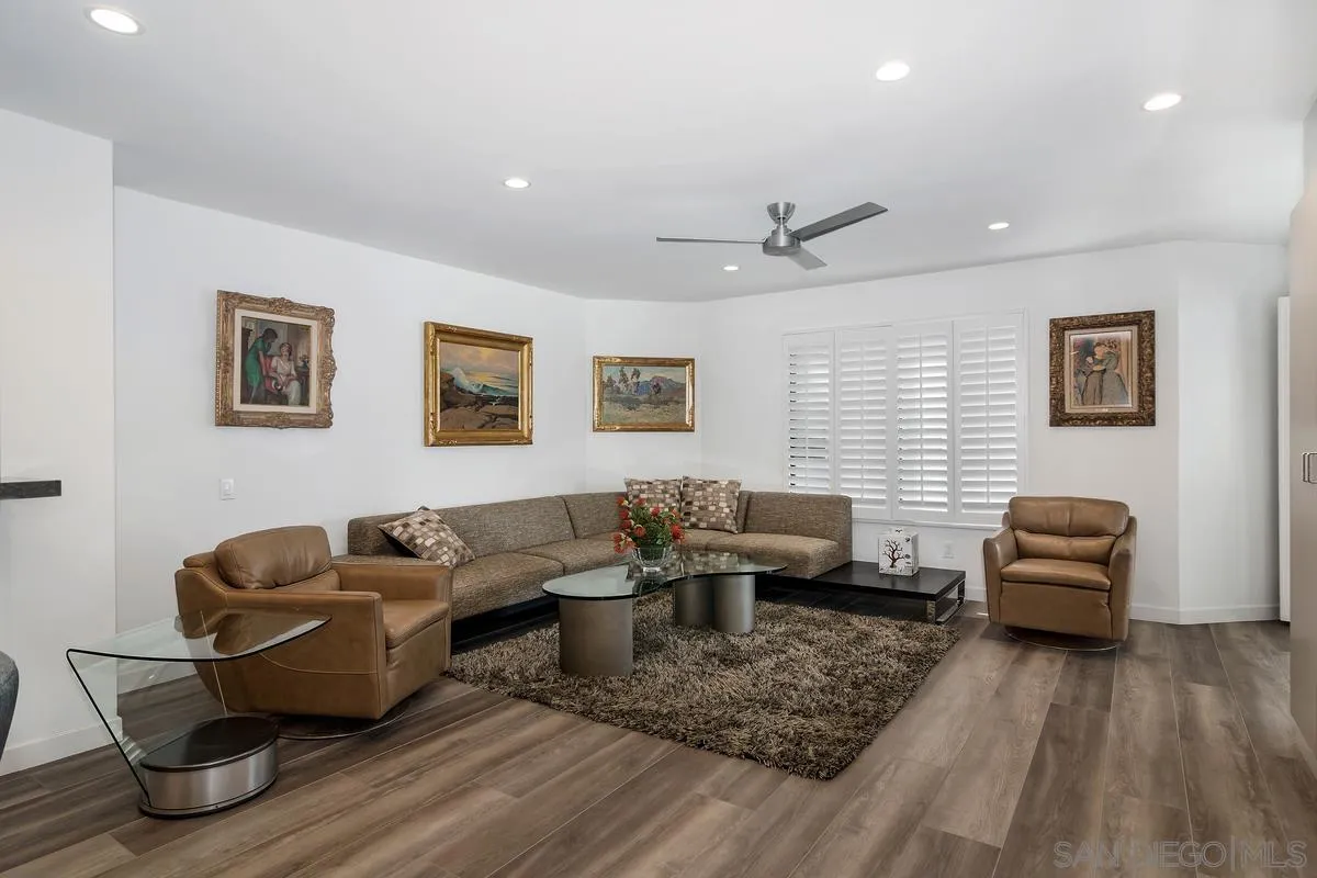 100 Coast Boulevard, Unit 304 La Jolla, CA 92037 - Photo 6 of 36 a living room with furniture and wooden floor