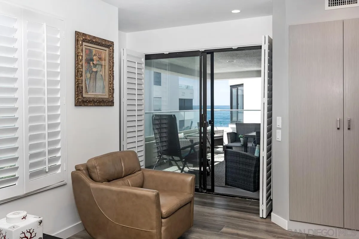 100 Coast Boulevard, Unit 304 La Jolla, CA 92037 - Photo 9 of 36 a living room with furniture and a window