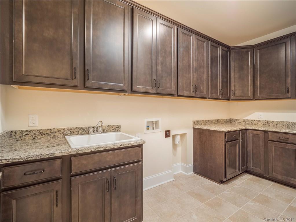 2222 Watermark Point Place Fort Mill, SC 29708 - Photo 16 of 24 a kitchen with stainless steel appliances granite countertop cabinets and sink