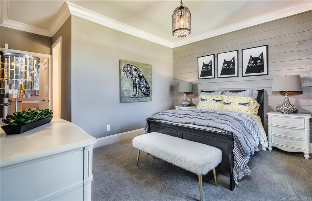 2222 Watermark Point Place Fort Mill, SC 29708 - Photo 18 of 24 a bedroom with a bed and a chandelier