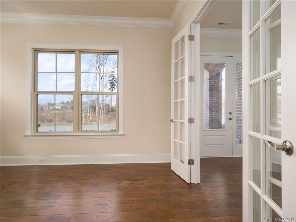 2222 Watermark Point Place Fort Mill, SC 29708 - Photo 3 of 24 an empty room with wooden floor and windows