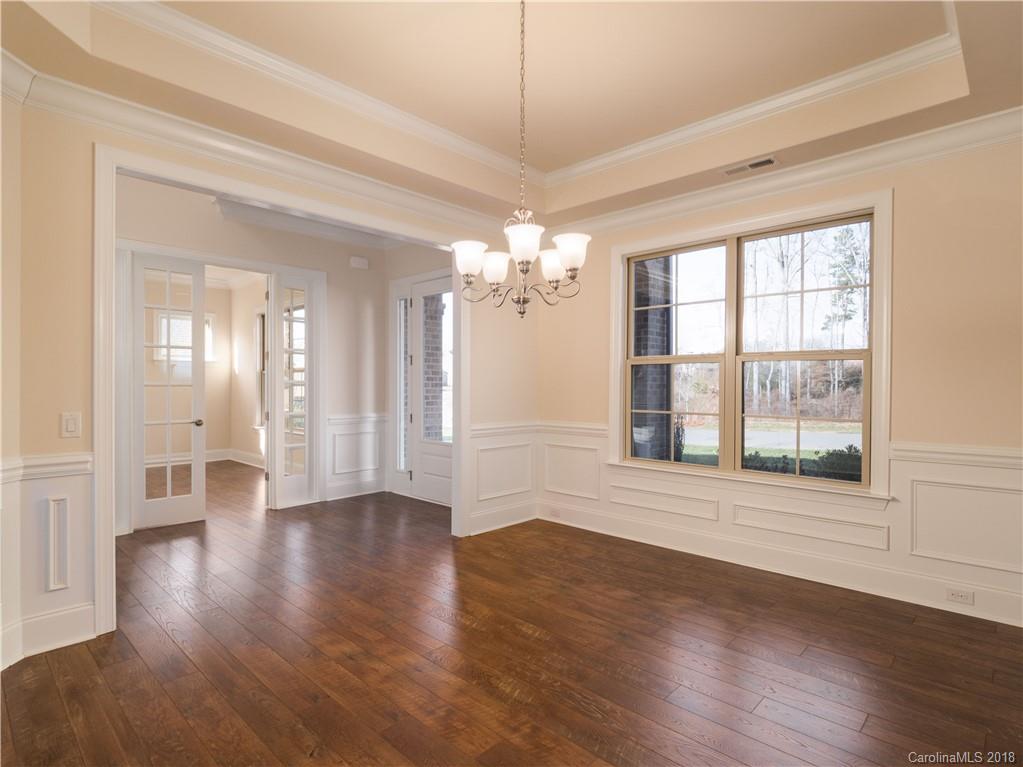 2222 Watermark Point Place Fort Mill, SC 29708 - Photo 5 of 24 a view of an empty room with wooden floor and a window