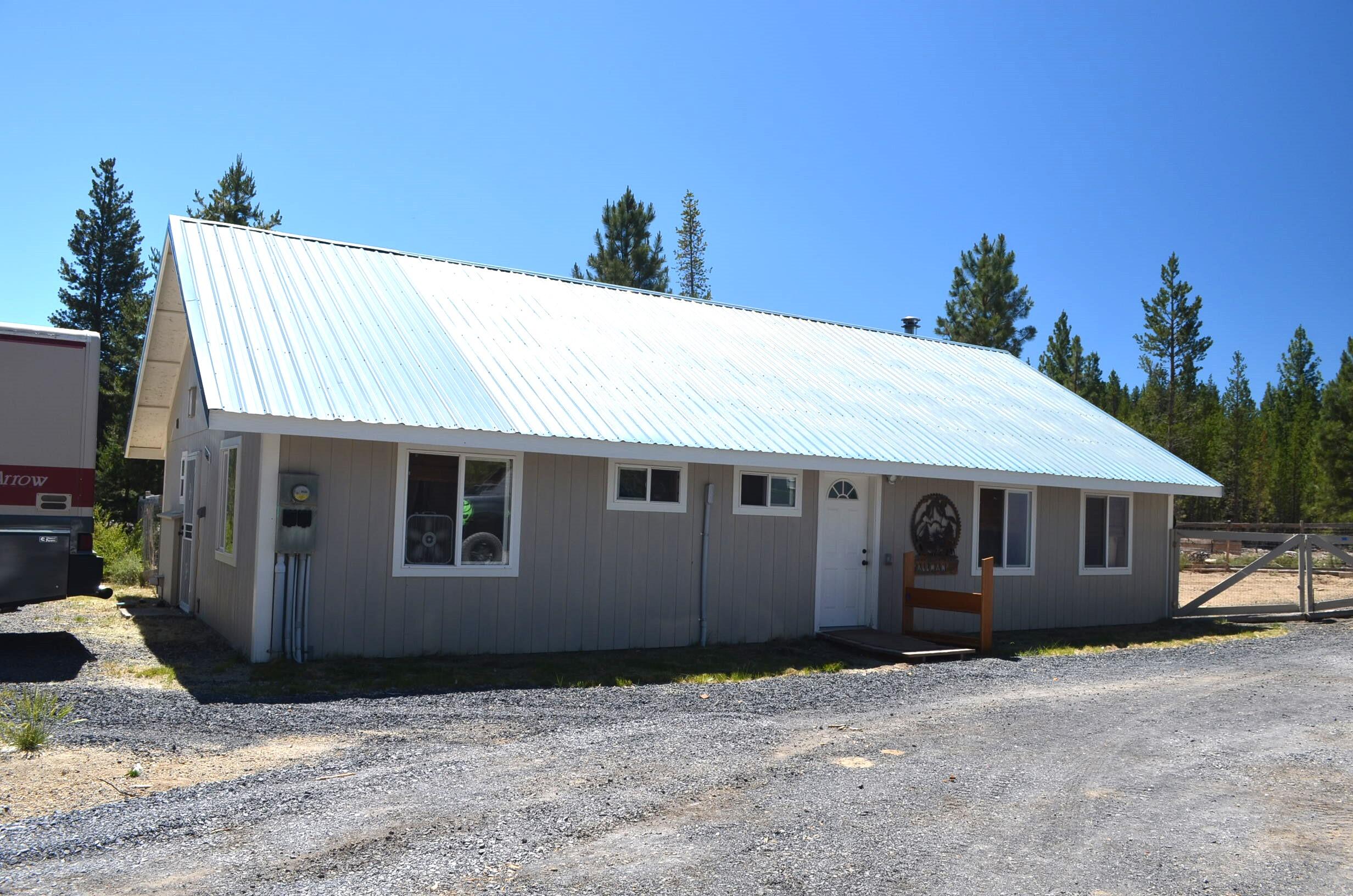 132860 Highway 97 Crescent, OR 97733 - Photo 1 of 25 a house with a tree in the background