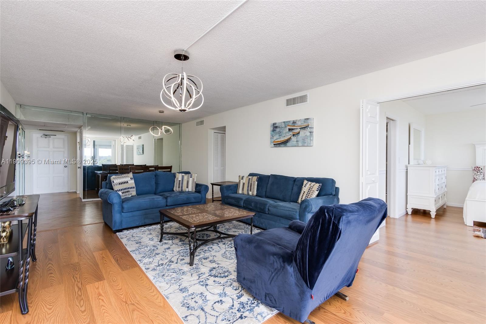 2671 South Course Drive, Unit 506 Pompano Beach, FL 33069 - Photo 14 of 31 a living room with furniture and a large window