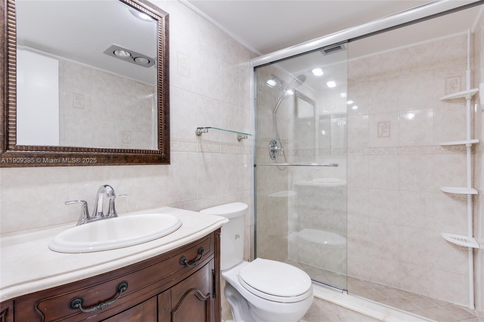 2671 South Course Drive, Unit 506 Pompano Beach, FL 33069 - Photo 24 of 31 a bathroom with a sink a toilet and shower