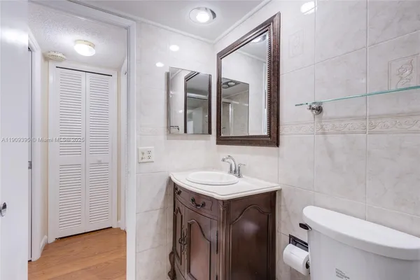 a view of a room with a table and chairs
