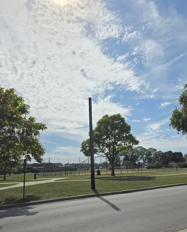 a view of a golf course with a lake
