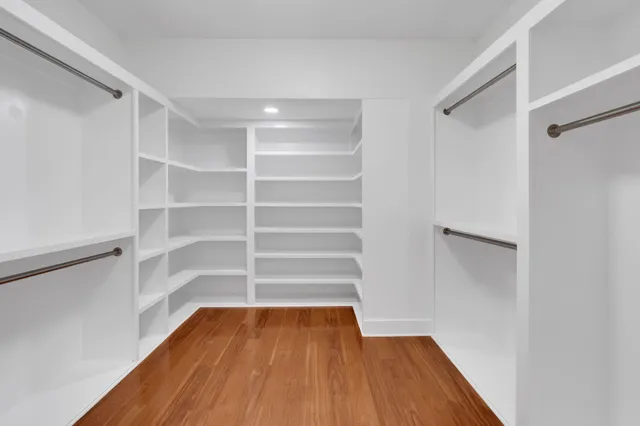 a view of an empty room with windows