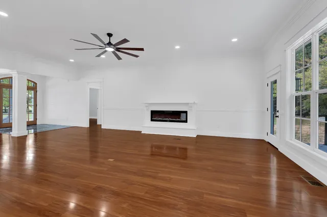 a view of a room with window and wooden floor
