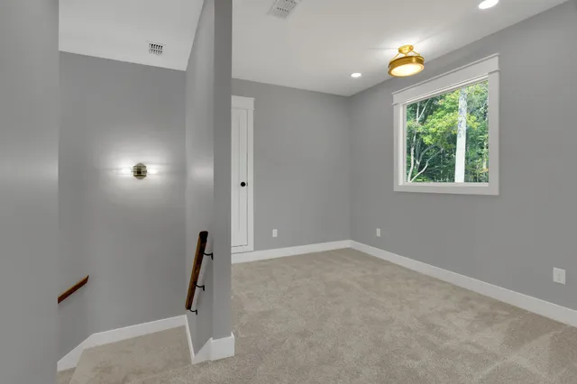 a view of a lake with a yard