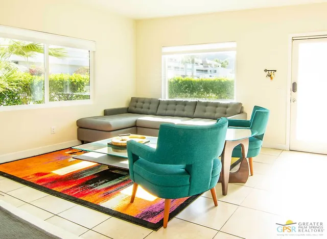 a living room with furniture and a window