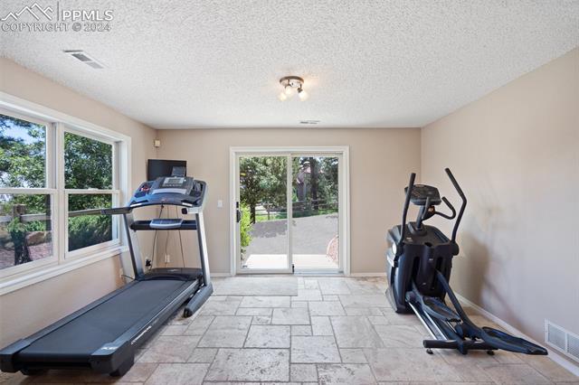 6150 Wilson Road Colorado Springs, CO 80919 - Photo 5 of 9 Bright & open lower level invites the outside in