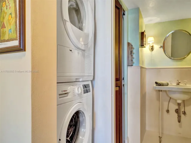 a view of a bathroom with washer and dryer